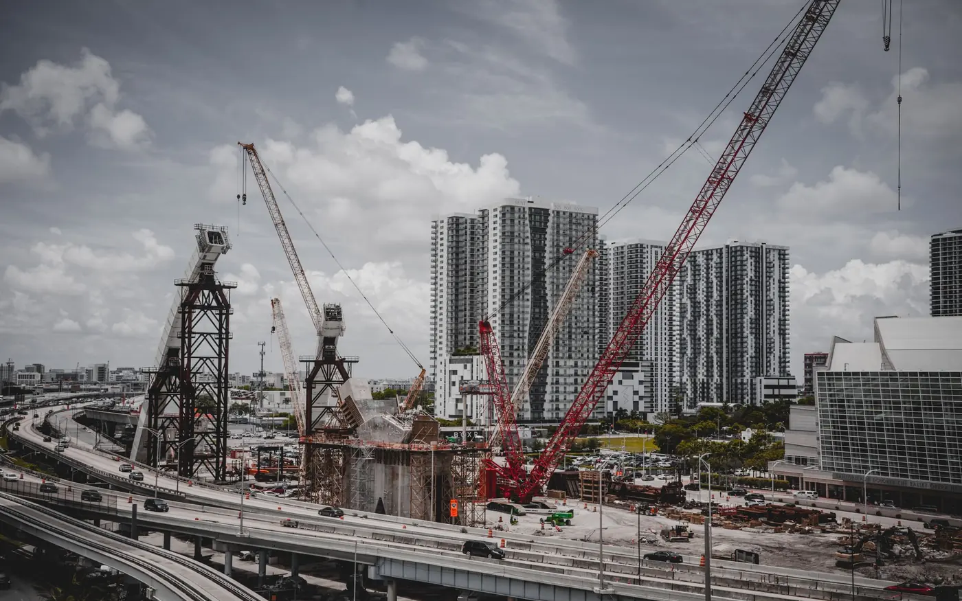 Tower cranes over a large urban construction site